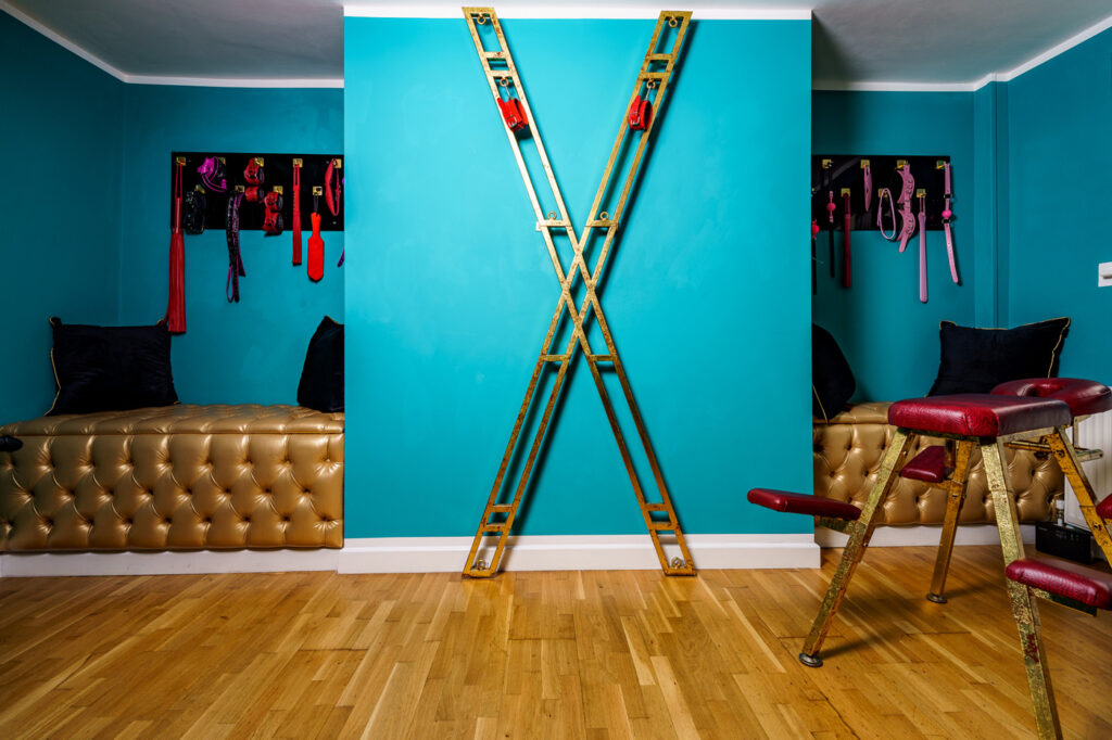 bondagebox st andrews cross in turquoise room with wooden floor UK